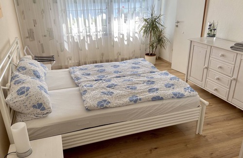 Woltersdorf Apartment | Large apartment with garden, barbecue area, rowing boat, jetty, SUP boards