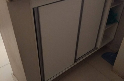 Nazare Apartment | Large bedroom and living room, laundry area, washing machine. He doesn't even know how to climb stairs