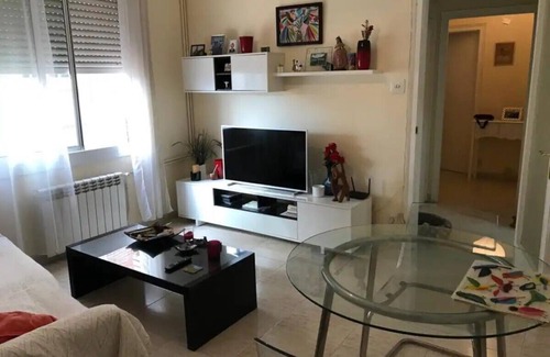 Sant Gervasi – la Bonanova Apartment | Large double bedroom with desk, double bed, large wardrobe and window.