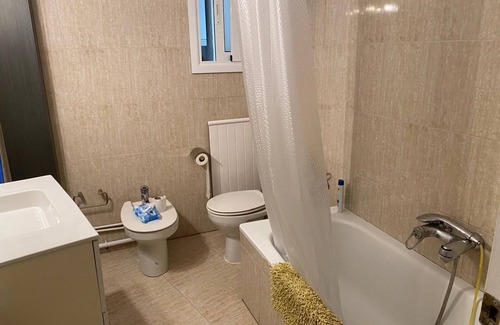 Sant Gervasi – la Bonanova Apartment | Large double bedroom with desk, double bed, large wardrobe and window.
