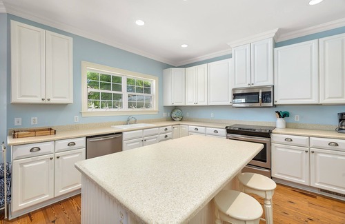 East Beach House | Large Home with Pool, Kids' Play Den and Steps to Beach