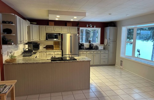 Kootenay Boundary House | Large Lakefront Home w Private Dock & picturesque Mountain Views on Jewel Lake!