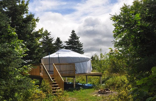 Indian Brook Resort | Large sky blue yurt at Cabot Shores Wilderness Resort