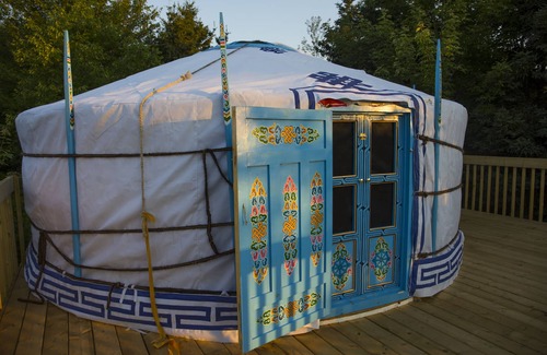 Indian Brook Resort | Large sky blue yurt at Cabot Shores Wilderness Resort