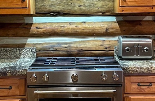 Highland Meadows Cabin | Lena's Cabin in Vail is nestled right beside Gore Creek, minutes from skiing.