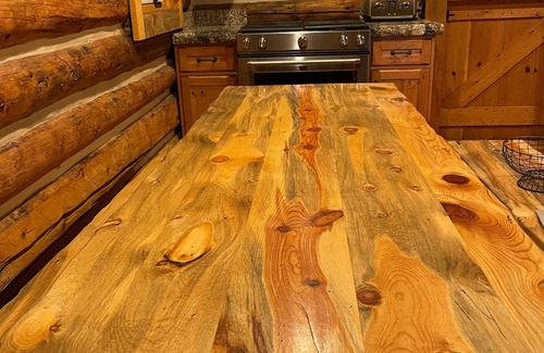 Highland Meadows Cabin | Lena's Cabin in Vail is nestled right beside Gore Creek, minutes from skiing.
