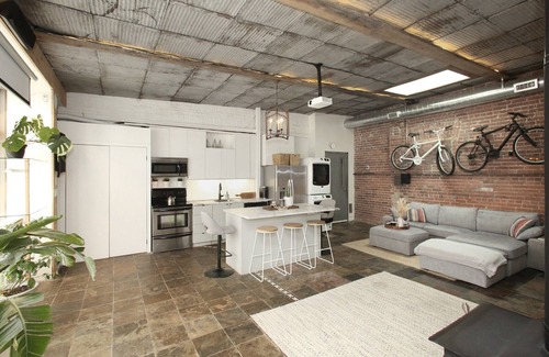 Leslieville Apartment | Leslieville LOFT with Wood Burning Fireplace and Skylights! Parking Included.