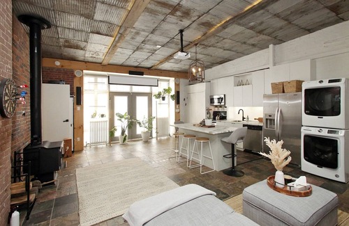 Leslieville Apartment | Leslieville LOFT with Wood Burning Fireplace and Skylights! Parking Included.