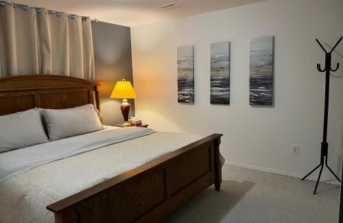 Promontory House | Licensed spacious basement suite with one king-size bed