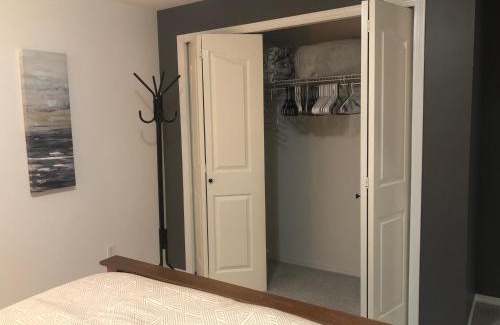 Promontory House | Licensed spacious basement suite with one king-size bed