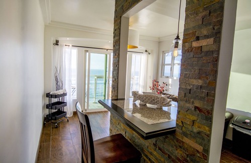 Costa Apartment | Light & Charming Beachfront w/oceanviews, steps to restaurants & nightlife