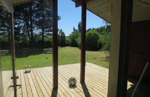 Follenslev Cottage | Light wooden cabin at Zealand's best beach.