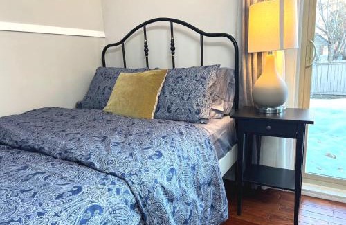 Southwest Calgary House | Lily room near golf and banff costco newly renovated queen size bed Single bathroom sofa TV