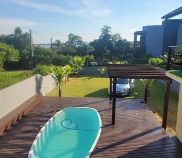 Ibiraquera House | LINDA CASA COM PISCINA DE FRENTE PARA A LAGOA