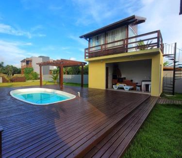 Ibiraquera House | LINDA CASA COM PISCINA DE FRENTE PARA A LAGOA