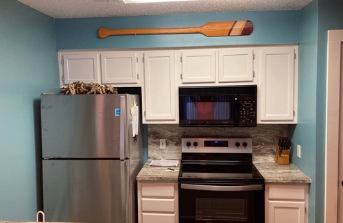 Cherry Grove Beach Condo | Listen to ocean waves from this beautifully updated condo with a lake view!
