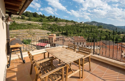Beceite Apartment | Lo Tossal II. fireplace and terrace
