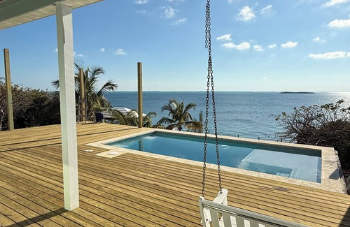 Great Guana Cay House | LOBSTER SEASON SPECIAL-NEW POOL & DECKS Luxury home with dock on Sea of Abaco