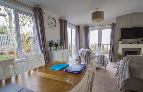 Corton Cabin | Lodge with decking and sea views at Azure Seas Park in Suffolk ref 32212OG