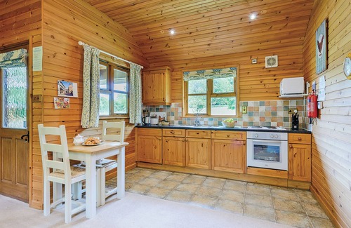 Kilcot Ski Chalet | Lodge with one king-size double with en suite bathroom with shower.