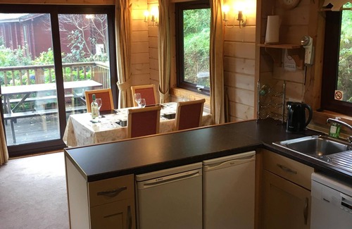 Woolfardisworthy Cabin | Lodge With Sun Deck & Enclosed Garden. Access to nearby private fishing lakes