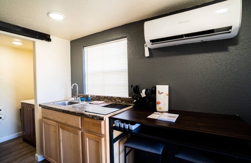 Brazoria Cabin | Lofted Cabin w/ 2 beds! Large walk-in shower & ktichen - Short walk to the river