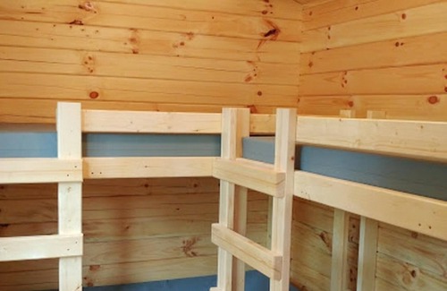 Williamsburg Cabin | Log Cabin - Williamsburg Pet-Friendly Log Cabin – Heated Pool, Free Game Room, Near Parks