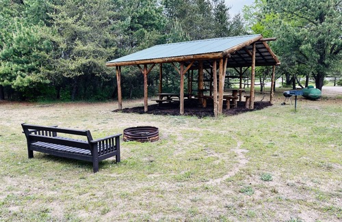Thompsonville Cabin | Log Cabin with Hot Tub 2 Miles from Crystal Mountain!