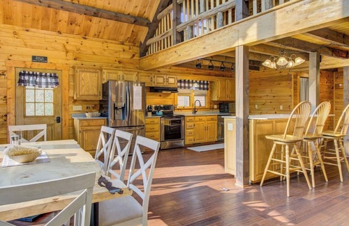 Cedarhurst Cabin | Log Cabin with living room fireplace and hot tub
