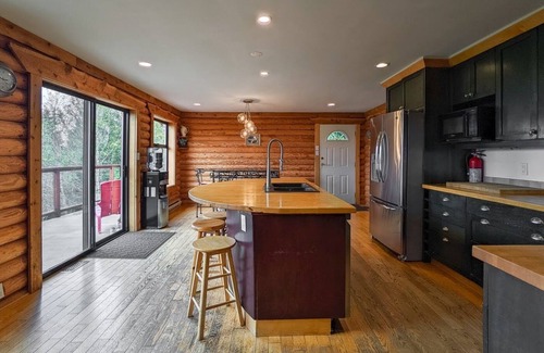 Shawnigan Lake House | Log Home on 5 Acres sleeps 10 comfortably three bedrooms plus more sleep areas.