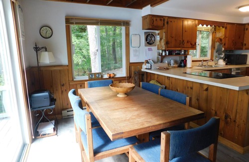 Naples Ski Chalet | Long Lake chalet and guest house with 200' of water frontage and sunset views
