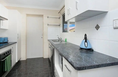 Mount Louisa House | Lovely 3BR home surrounded by lush greenery. Perfect escape for tranquility.