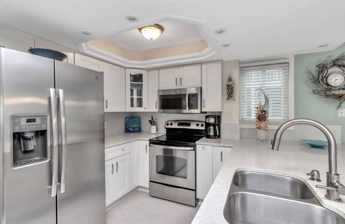 Indian Shores Condo | Lovely condo steps to beach…wow sunsets.