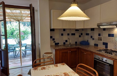 Rosignano Marittimo Apartment | Lovely flat with private covered terrace,large pool and shared garden,Wi-Fi.