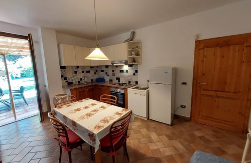 Rosignano Marittimo Apartment | Lovely flat with private covered terrace,large pool and shared garden,Wi-Fi.