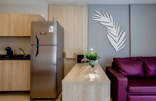 Caminho das Arvores Apartment | Lovely Suite Compact Kitchen in Central Region