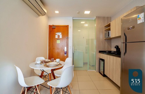 Caminho das Arvores Apartment | Lovely Suite Compact Kitchen in Central Region