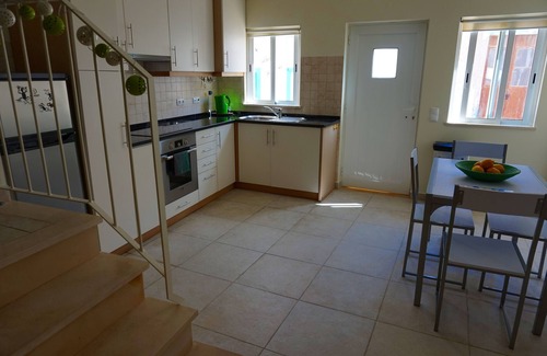 Raposeira House | Lovely village house close to many beaches. Large private sunny roof terrace.