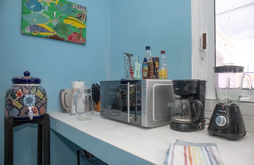Colonia Andres Apartment | Luna - Alexa art loft w extras - bicycles & snorkel gear. shared pool & grill