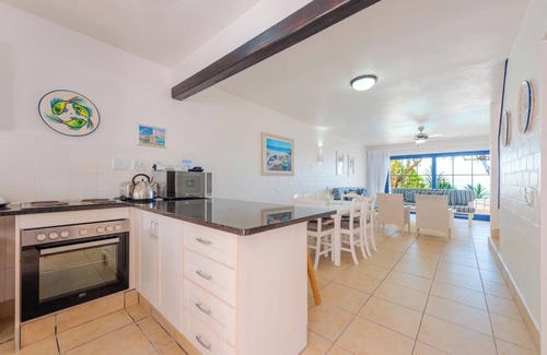 Mykonos Apartment | Luxe Beachside Retreat | Patio | Resort Perks