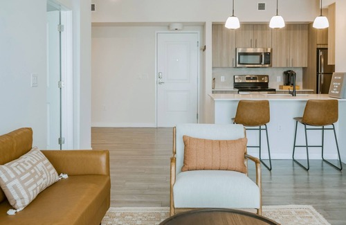Miami Gardens Condo | Luxe, dog-friendly condo with resort-style pool, playground, gym, patio, & lake
