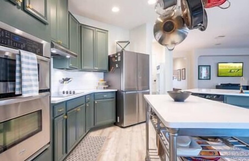 Wetmore House | Luxe Home-Designer BTHRM-Covered Deck-Weber Grill