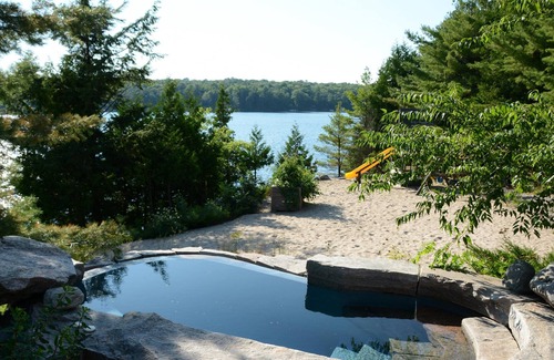 Seguin Villa | Luxury Cottage-Boathouse - 8 Bdrms, Waterfall! SW Exposure! Water Tramp! It ALL!