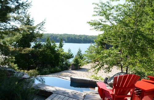 Seguin Villa | Luxury Cottage-Boathouse - 8 Bdrms, Waterfall! SW Exposure! Water Tramp! It ALL!