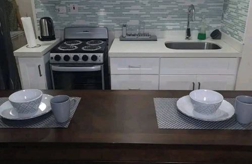 Portmore Apartment | Luxuriate poolside or on the private beach at this comfy studio apartment.