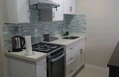 Portmore Apartment | Luxuriate poolside or on the private beach at this comfy studio apartment.