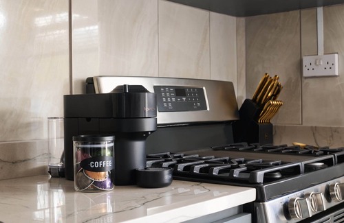 Kingstown Apartment | Luxurious 1 bedroom haven, modern kitchen moments from pristine black sand beach
