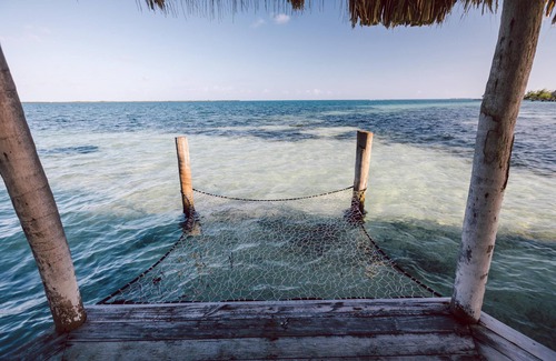Thatch Caye Resort | Luxurious Air-Conditioned Cabana w/Rooftop Patio & Amazing Caribbean Sea Views