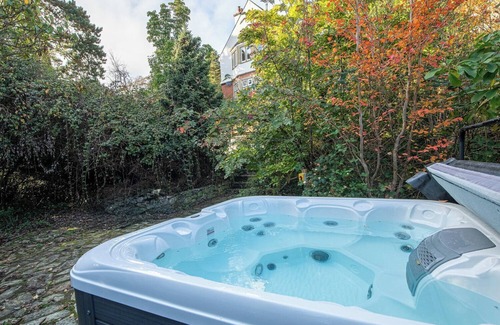 Menai Bridge House | Luxurious Arts and Crafts Home set in 5 Acres of Garden & Woodland onto Straits