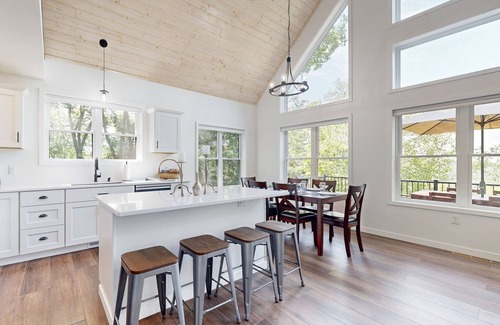 Eastman House | Luxurious home with hot tub, electric fireplace, and stunning views